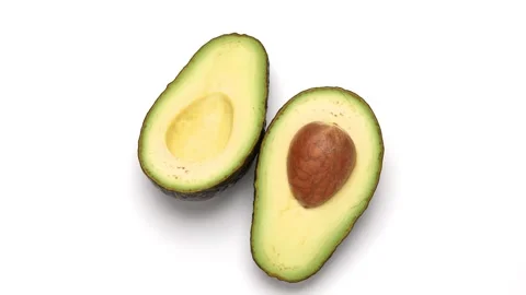 Avocado cut in half. Stock Footage 299873554
