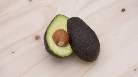 Avocado cut in half Stock Footage 300940188