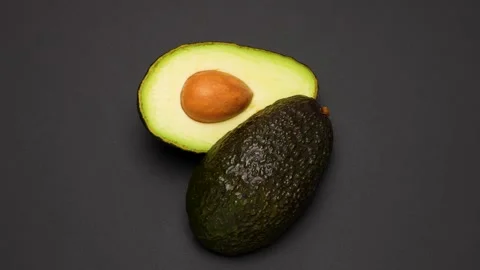Avocado cut in half Stock Footage 320379613