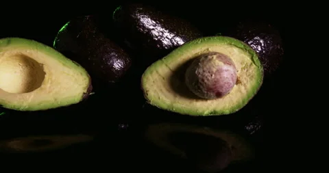 Avocado Cut In Half in the kitchen Stock Footage 243279486