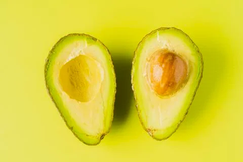 An avocado cut into half Stock Photos
