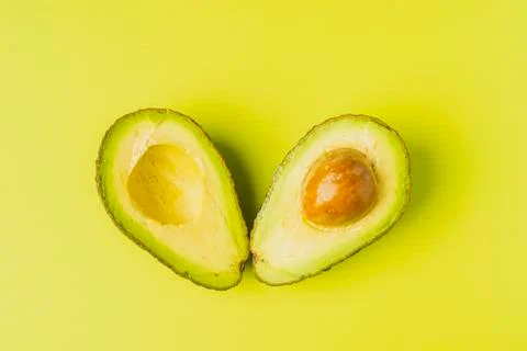 An avocado cut into half Stock Photos