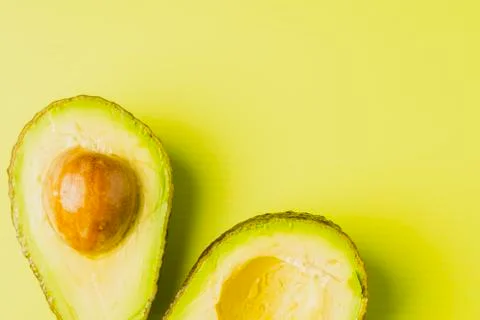 An avocado cut into half Stock Photos
