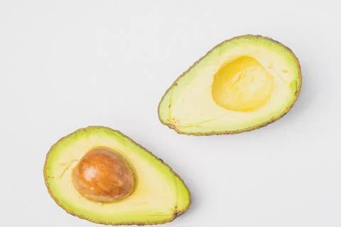 An avocado cut into half Stock Photos