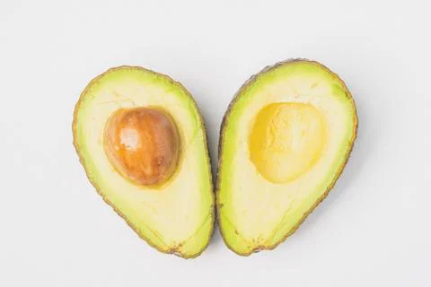 An avocado cut into half Stock Photos