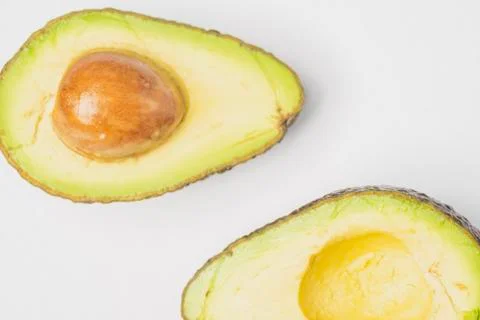 An avocado cut into half Stock Photos