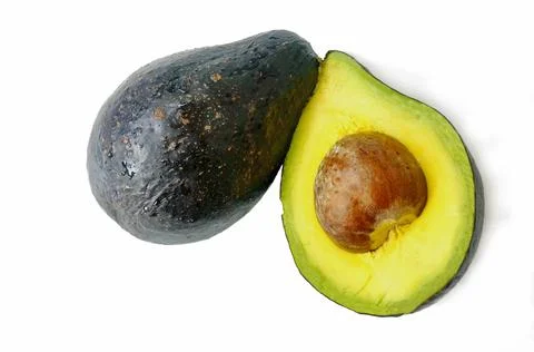 Avocado cut in half. Seed inside. Stock Photos