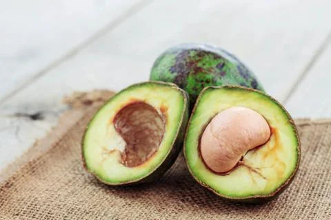 Avocado cuts on sack. Stock Photos