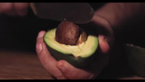 Avocado Cutting in Slow Motion – Cinematic Food Prep Sequence Stock Footage 306596319