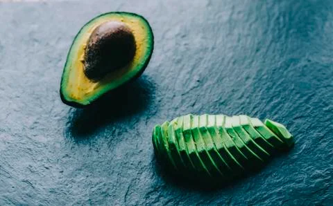 Avocado On Desk Stock Photos