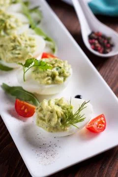 Avocado deviled eggs Stock Photos