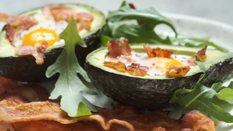 Avocado Egg Boats with bacon Stock Footage 101330678