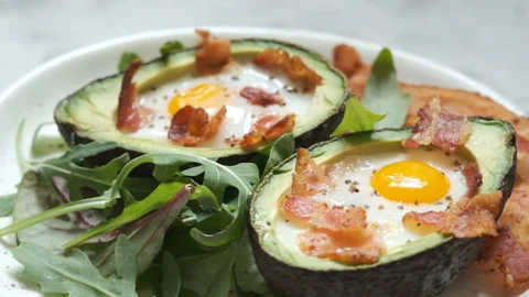 Avocado Egg Boats with bacon Stock Footage 101331057
