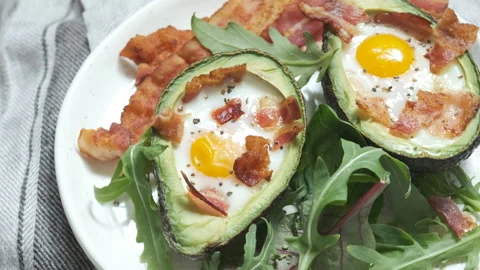 Avocado Egg Boats with bacon Stock Footage 101334433