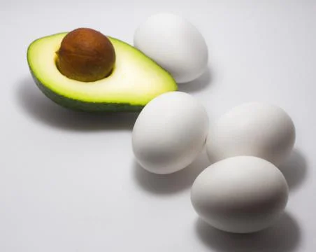 Avocado Egg white background Stock Photos