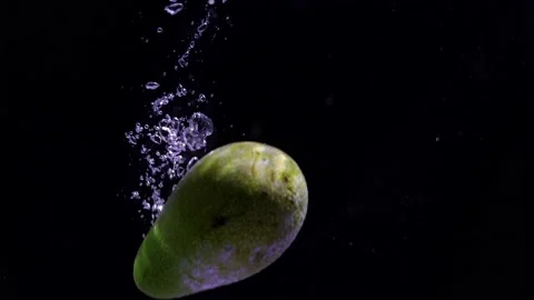 Avocado falling into water Stock Footage 144209729