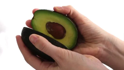 Avocado in female hands Stock Footage 231709827