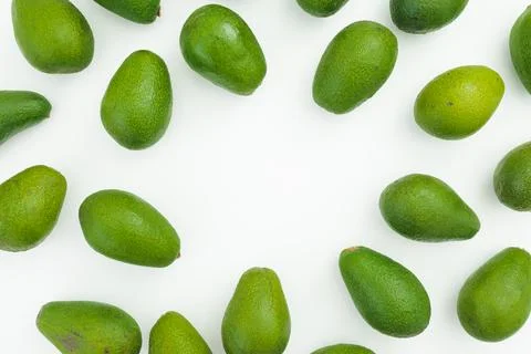 Avocado frame isolated on white background. Flat lay, top view. Food concept. Stock Photos
