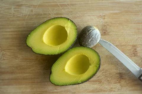 An avocado fruit cut in half 스톡 사진