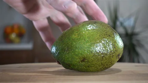 Avocado fruit cuts a knife in 4K Stock Footage 122558105