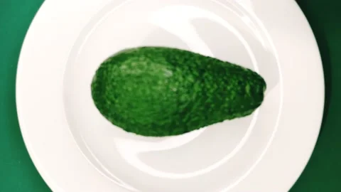 Avocado fruit on a plate. A source of polyunsaturated fatty acids. Stock-Footage 150688531