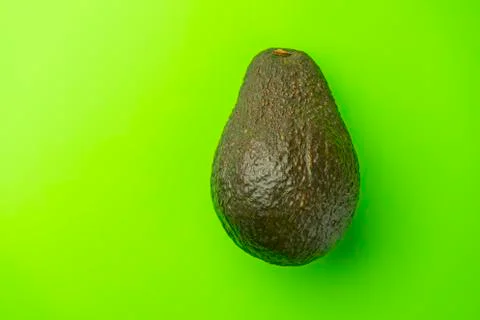 Avocado on a green background close-up. isolate Stock-Fotos
