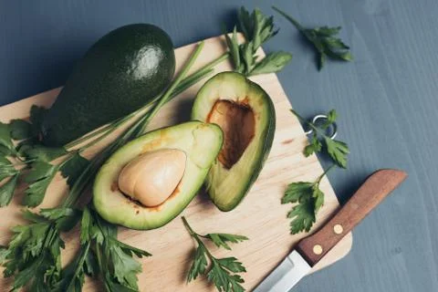 Avocado on a grey background. Stock Photos
