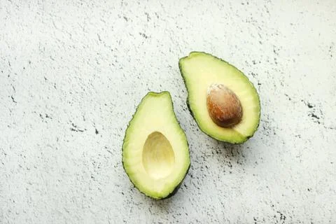 Avocado on grey background. Top view. Banner. Pop art design, creative summer Stock Photos
