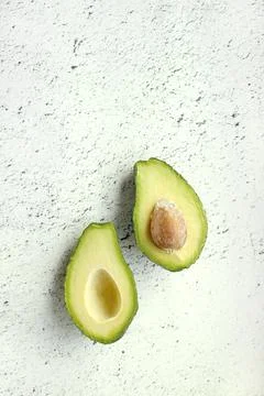 Avocado on grey background. Top view. Banner. Pop art design, creative summer Stock Photos