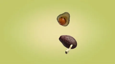 Avocado halves and slices that fall on a Yellow Green background. Stock Footage 178004726