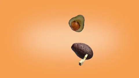 Avocado halves and slices that fall on the Orange background. Stock Footage 178478829