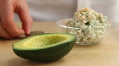 Avocado halves being filled with prawn cocktail Video stock 24652953