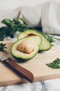 Avocado on a marble background. Stock Photos