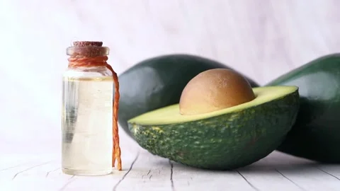 Avocado oil falling on top of the fruit slow motion slow motion of dripping 스톡 동영상 334641509