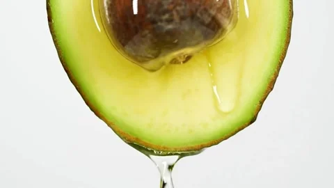 Avocado oil falling on top of the fruit slow motion slow motion of dripping 스톡 동영상 334641537