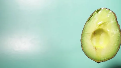 Avocado oil flows down the fruit, green essence, organic skincare, natural .. Stock Footage 258025565