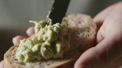 Avocado Paste Spread on Bread 1 Stock Footage 332520677