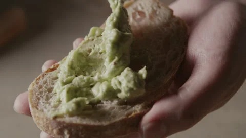 Avocado Paste Spread on Bread 2 Stock Footage 332520680