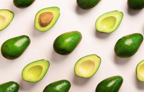 Avocado pattern on pink background. Top view. Banner. Pop art design, creat.. Stock Photos