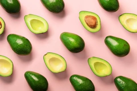 Avocado pattern on pink background. Top view. Banner. Pop art design, creat.. Stock Photos