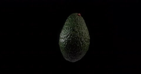 Avocado rotating with black background Stock Footage 233543828