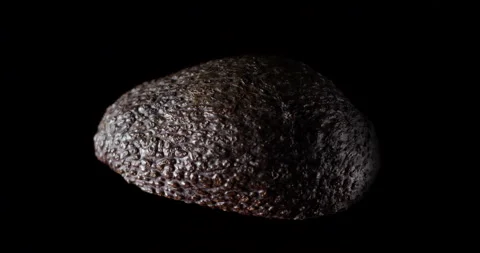 Avocado rotating isolated on black background, vertical studio shot Stock-Footage 254134501