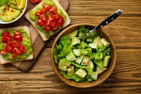 Avocado salad and toasts Stock Photos