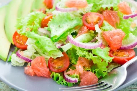 Avocado salad on a plate Stock Photos
