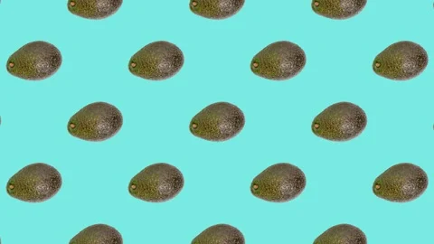 An Avocado in seamless loop pattern on a light blue background. Exotic fruits Stock Footage 222319235