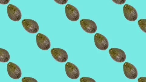 An Avocado in seamless loop pattern on a light blue background. Exotic fruits Stock Footage 222325356