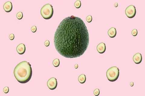 Avocado seamless pattern on light pink background Stock Photos
