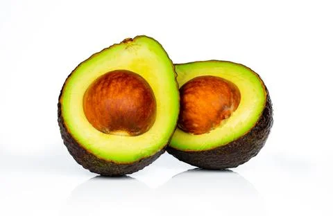 Avocado with seed isolated on white background. Source of omega 3 from natu.. 库存照片