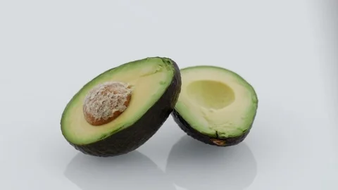 Avocado Sliced on Turntable - White Background Stock Footage 75707431