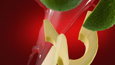 Avocado with Slices and Splash Falling on Deep Red Background Stock Footage 122703933